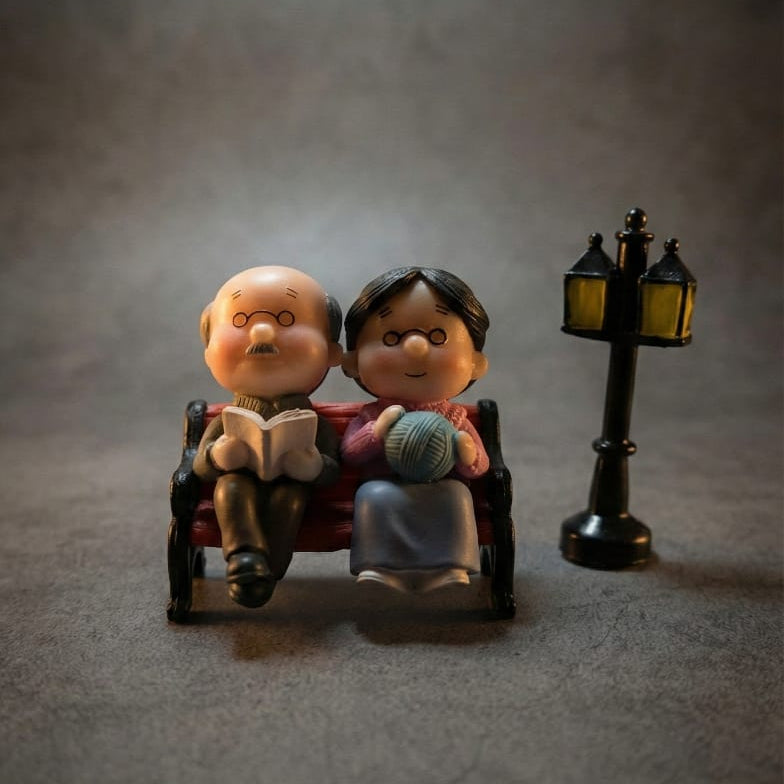 Aged Sitting Couple Miniature