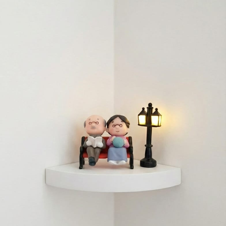 Aged Sitting Couple Miniature